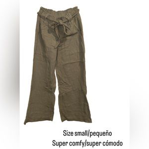 Size small. Super comfy. Some stretch to it.